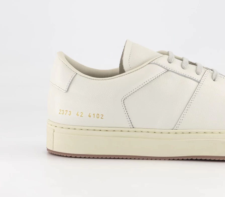 Common Projects Women's Decades Low Top Sneakers in Off White